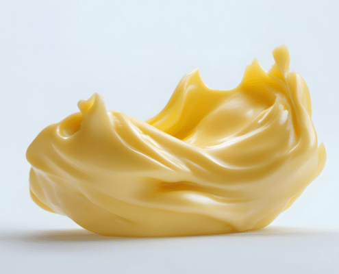 Butterflocke liegt auf weißer Fläche mit weißem Hintergrund